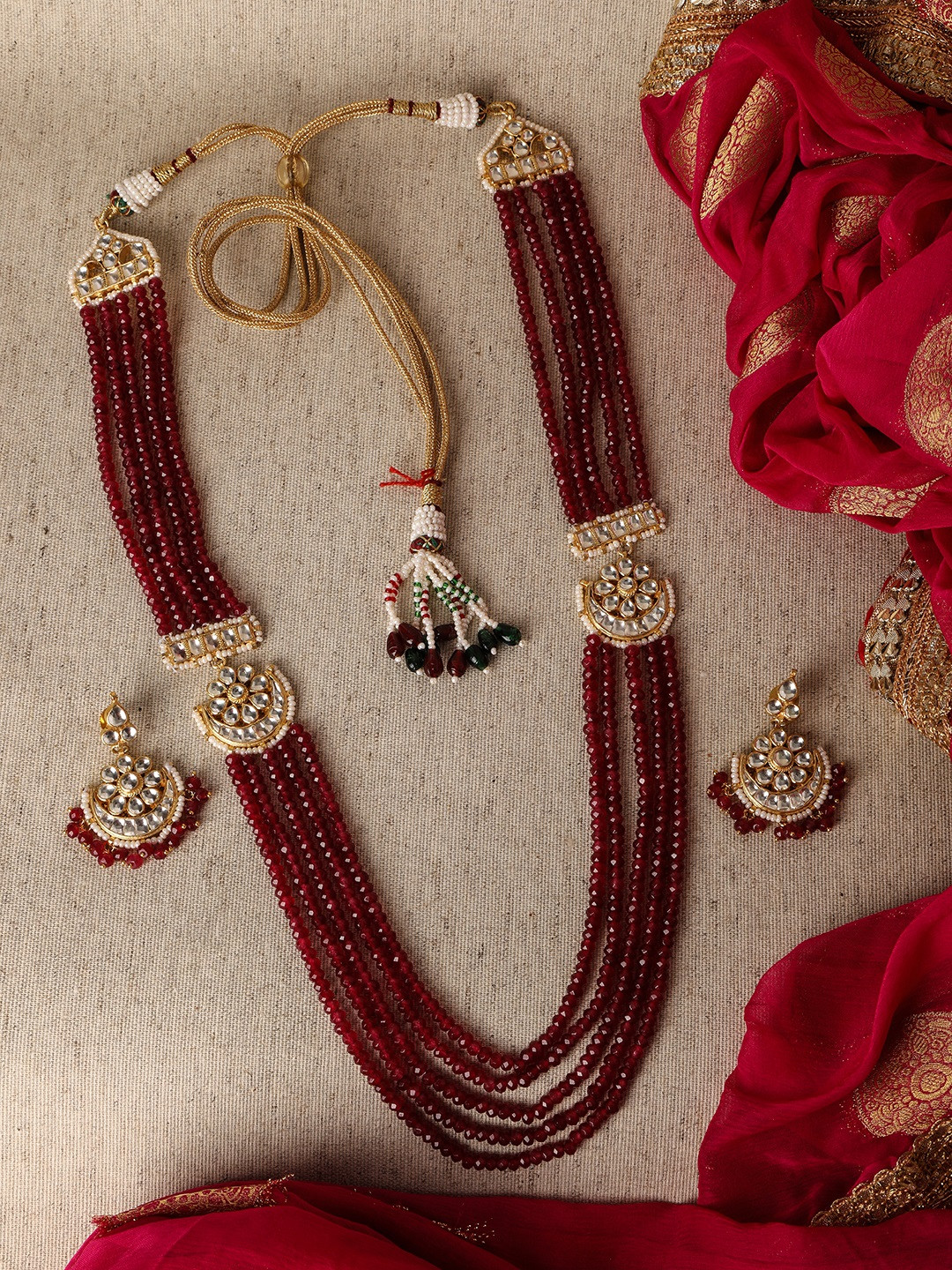 

AccessHer Gold-Plated Pachi Kundan and Ruby -Studded Handcrafted Jadua Jewellery Set