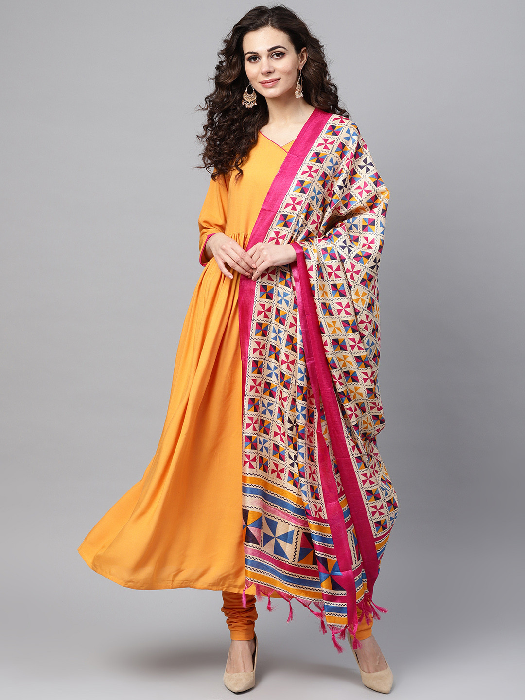 

Nayo Women Mustard Yellow & Magenta Solid Kurta with Churidar & Dupatta
