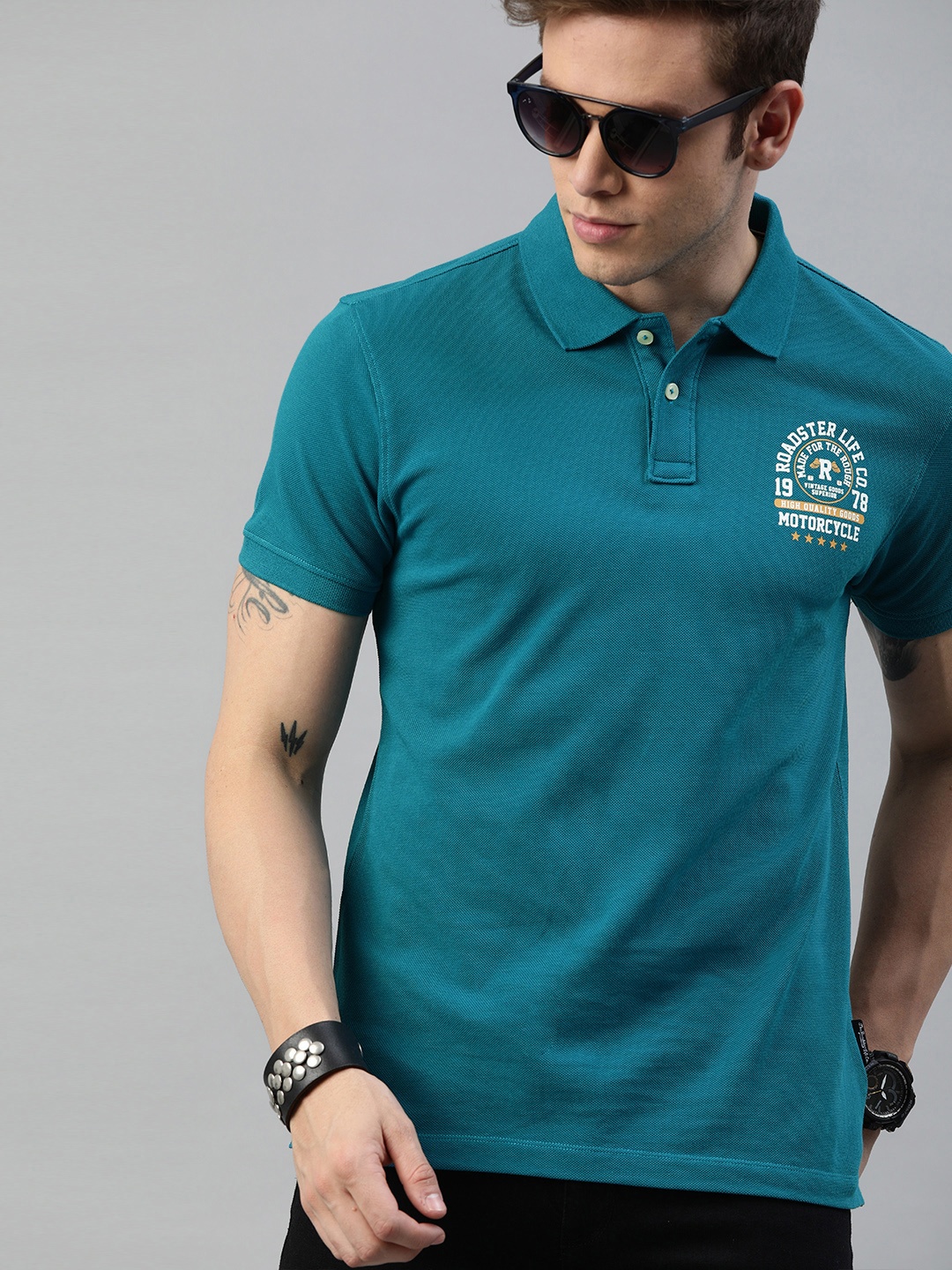 

Roadster Men Teal Solid Polo Collar Pure Cotton T-shirt with Printed Detail