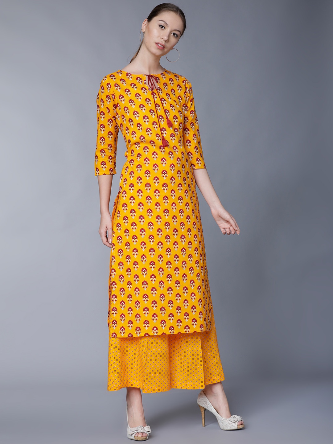 

Vishudh Women Yellow & Red Printed Kurti with Palazzos