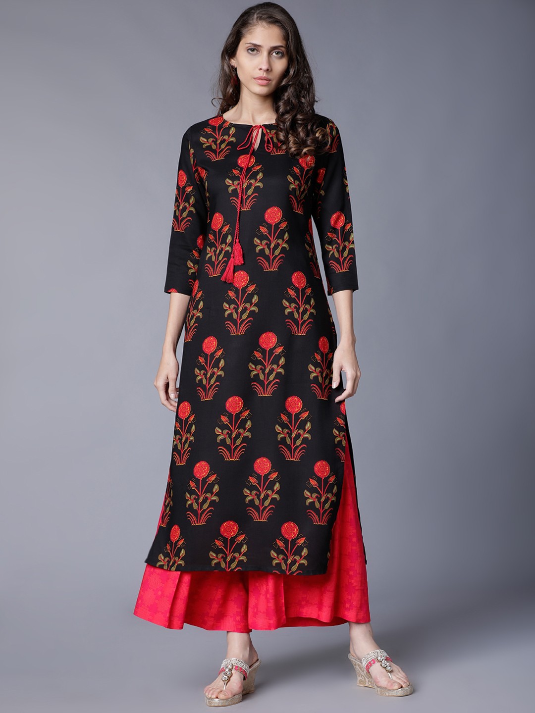 

Vishudh Women Black & Orange Printed Kurta with Palazzos