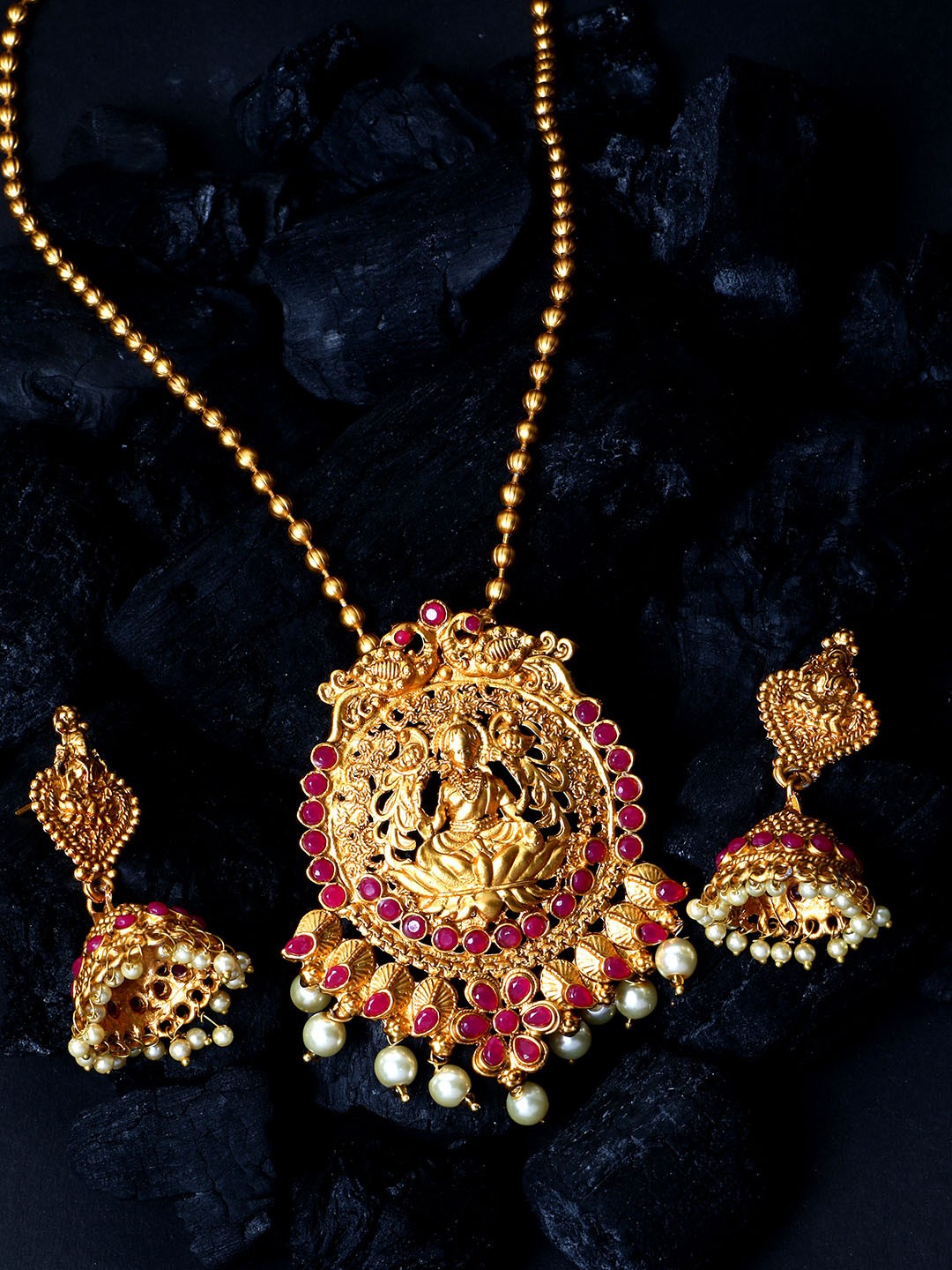 

ANIKAS CREATION Women Gold-Plated Goddess Laxmi Maroon Stone-Studded Temple Jewellery Set