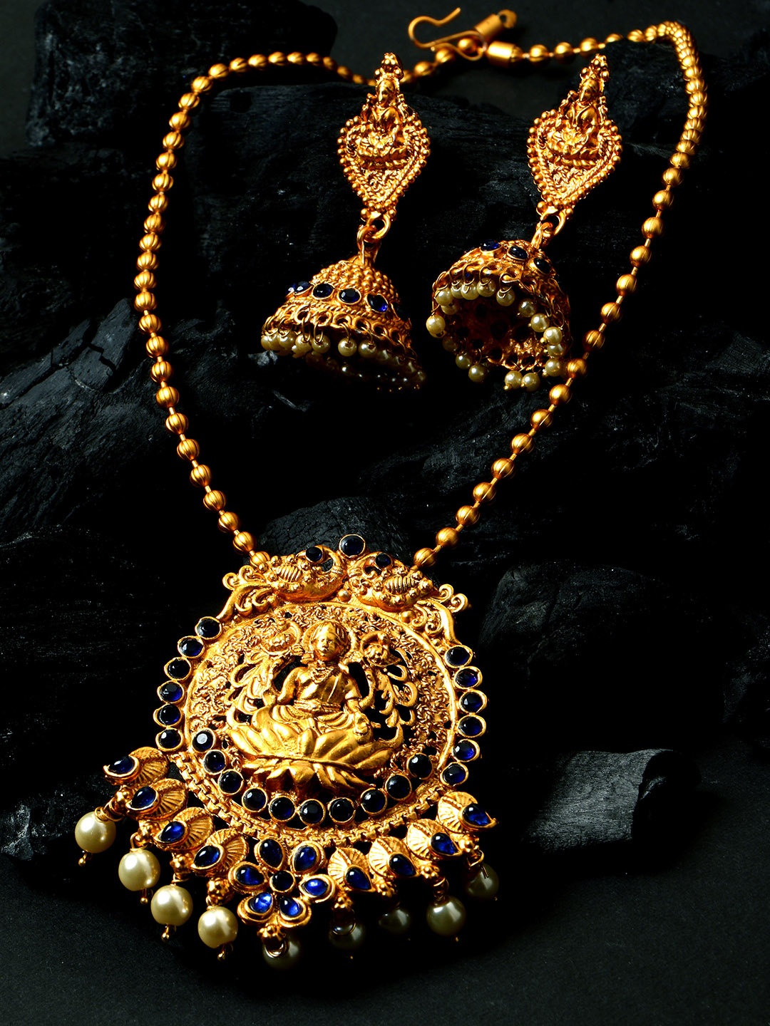 

ANIKAS CREATION Women Gold-Plated Goddess Laxmi Blue Stone-Studded Temple Jewellery Set