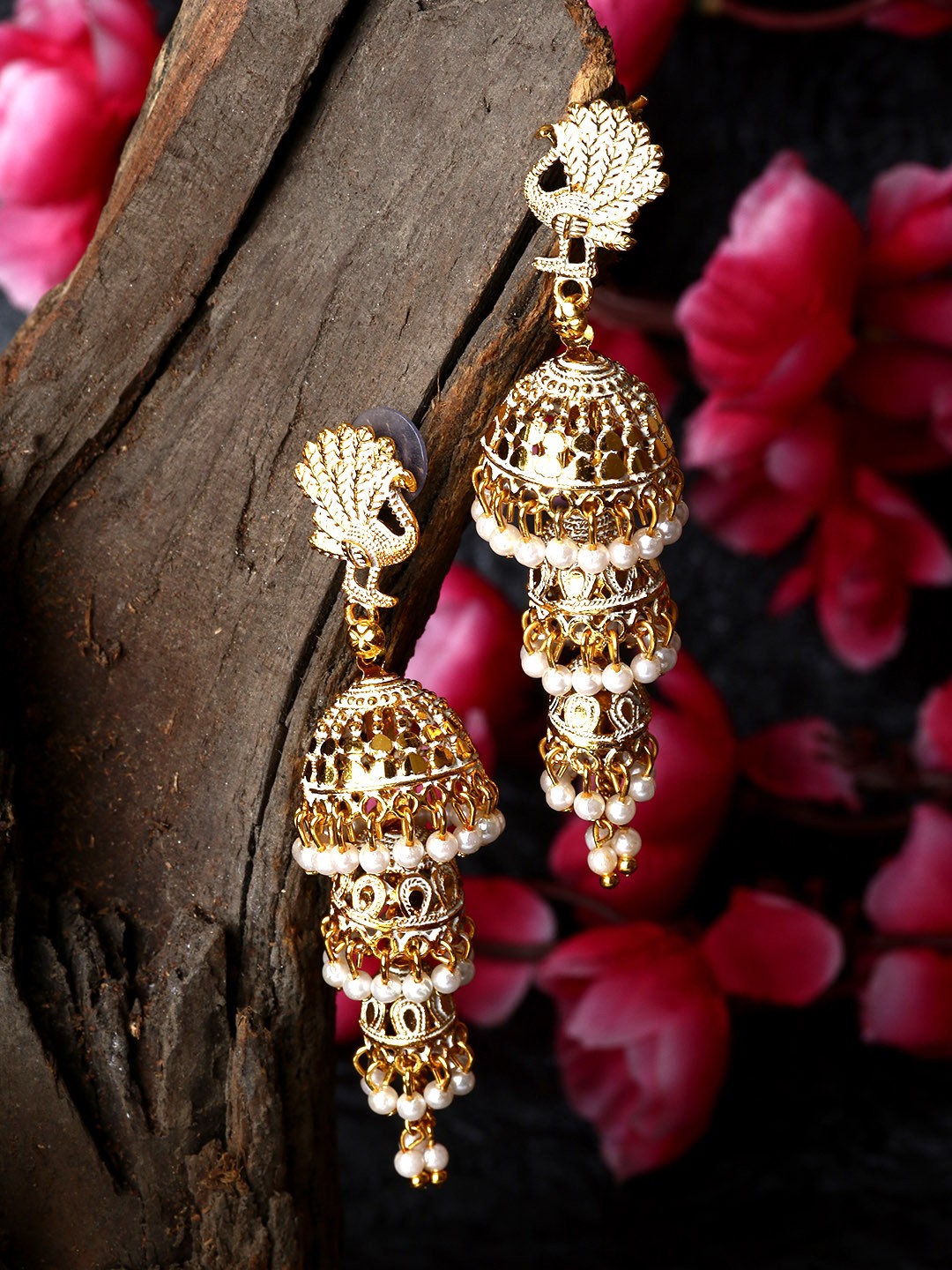 

ANIKAS CREATION Gold Plated & White Enamelled Peacock Shaped Jhumkas