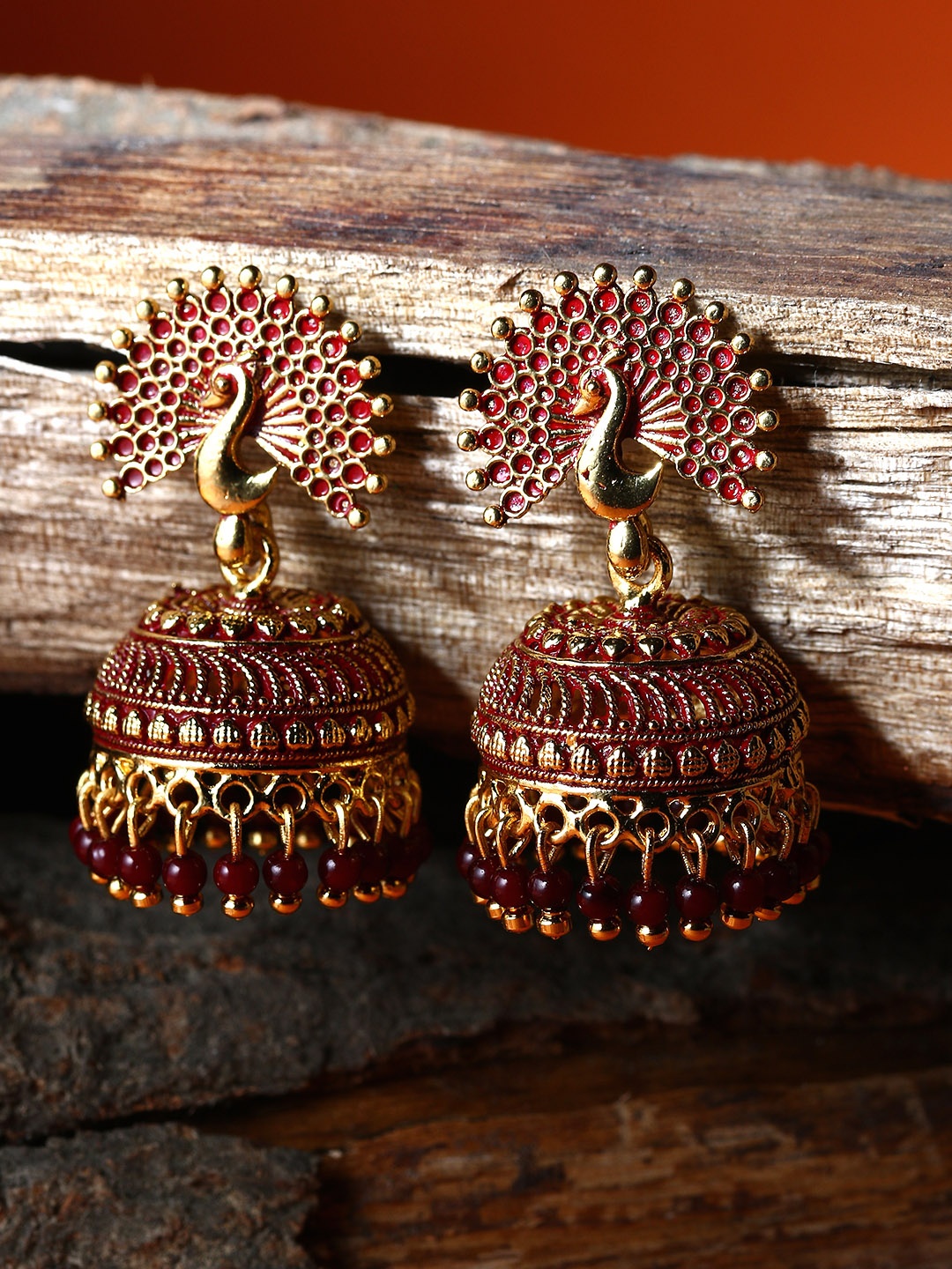 

ANIKAS CREATION Maroon & Gold-Plated Enamelled Dome Shaped Jhumkas
