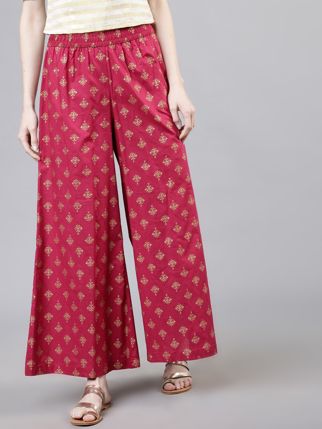 

Vishudh Women Pink & Gold-Toned Printed Flared Palazzos