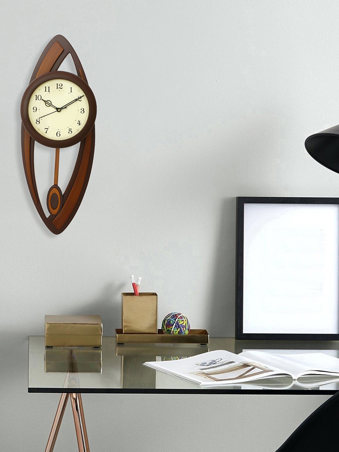 

eCraftIndia Brown 63.5 cm x 22.86 cm Handcrafted Oval Solid Analogue Wall Clock