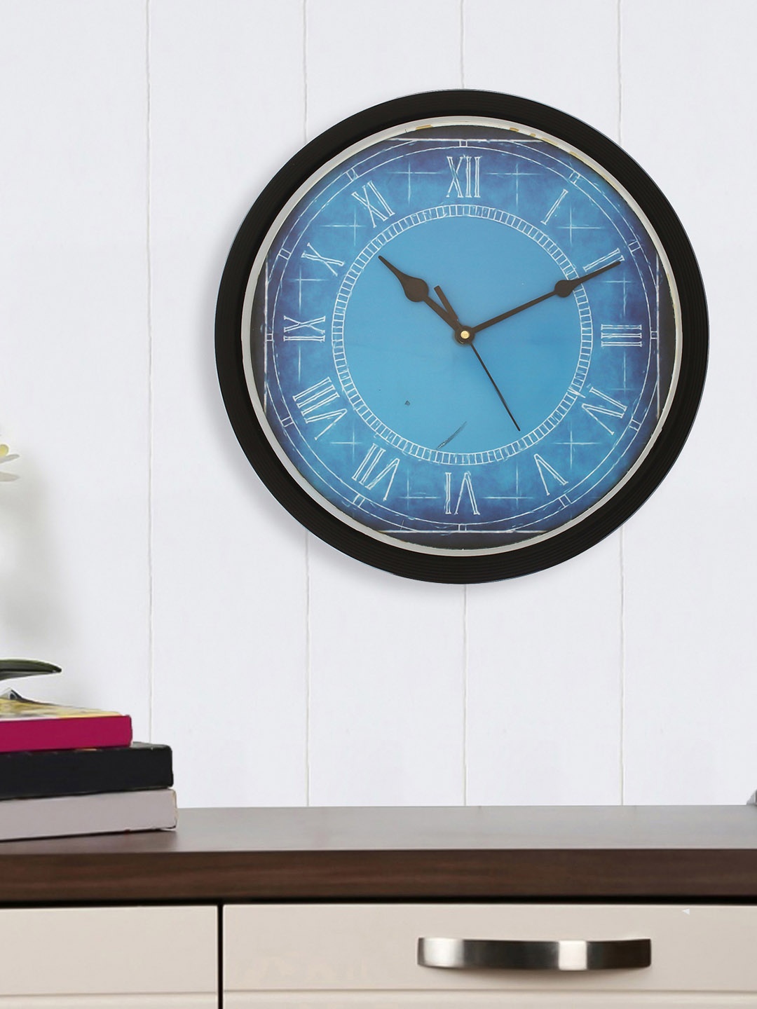 

eCraftIndia Black & Blue Round Printed Analogue Wall Clock (31.75 x 31.75 x 2.54)