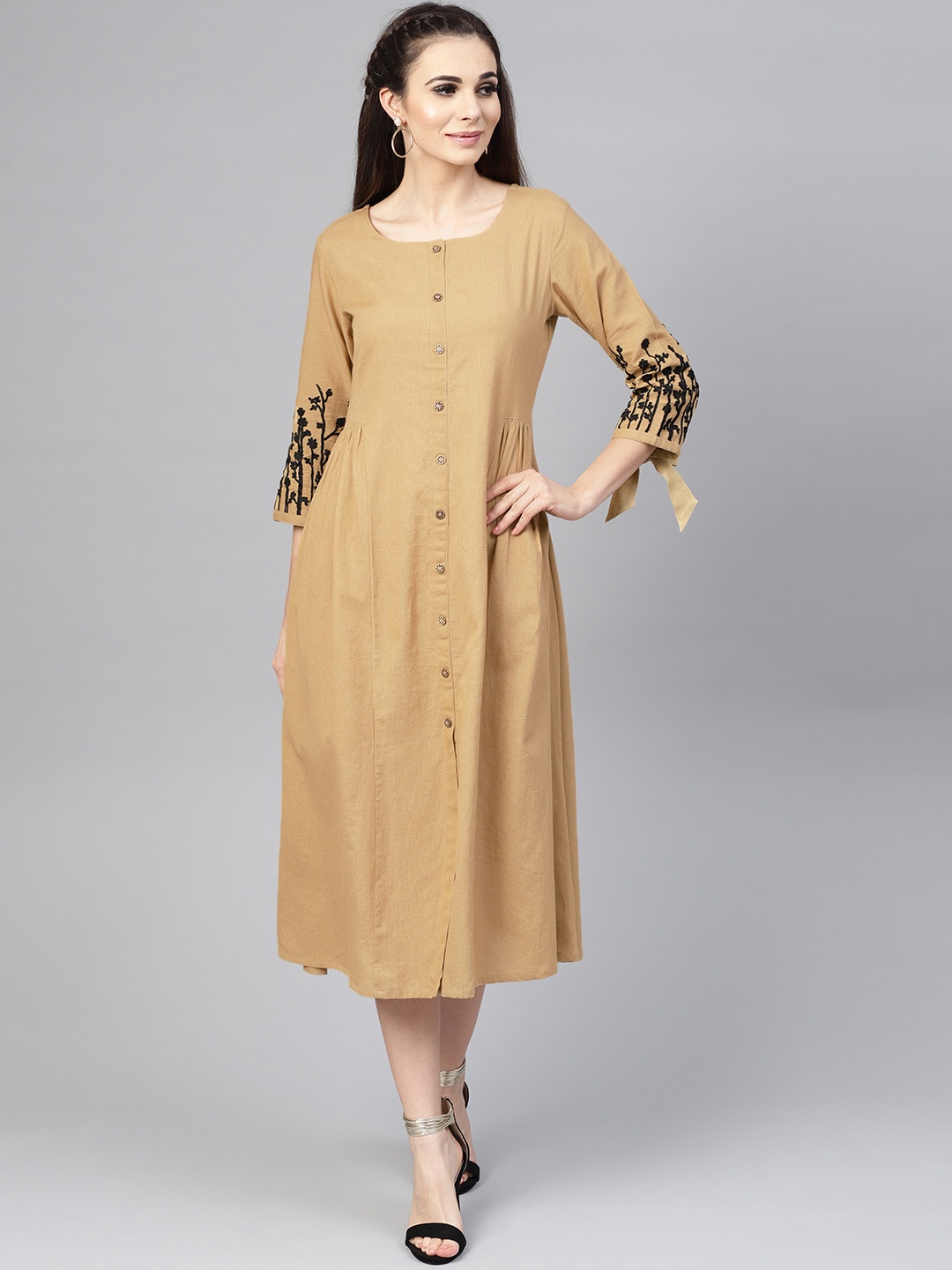 

Varanga Women Beige Solid Fit and Flare Dress