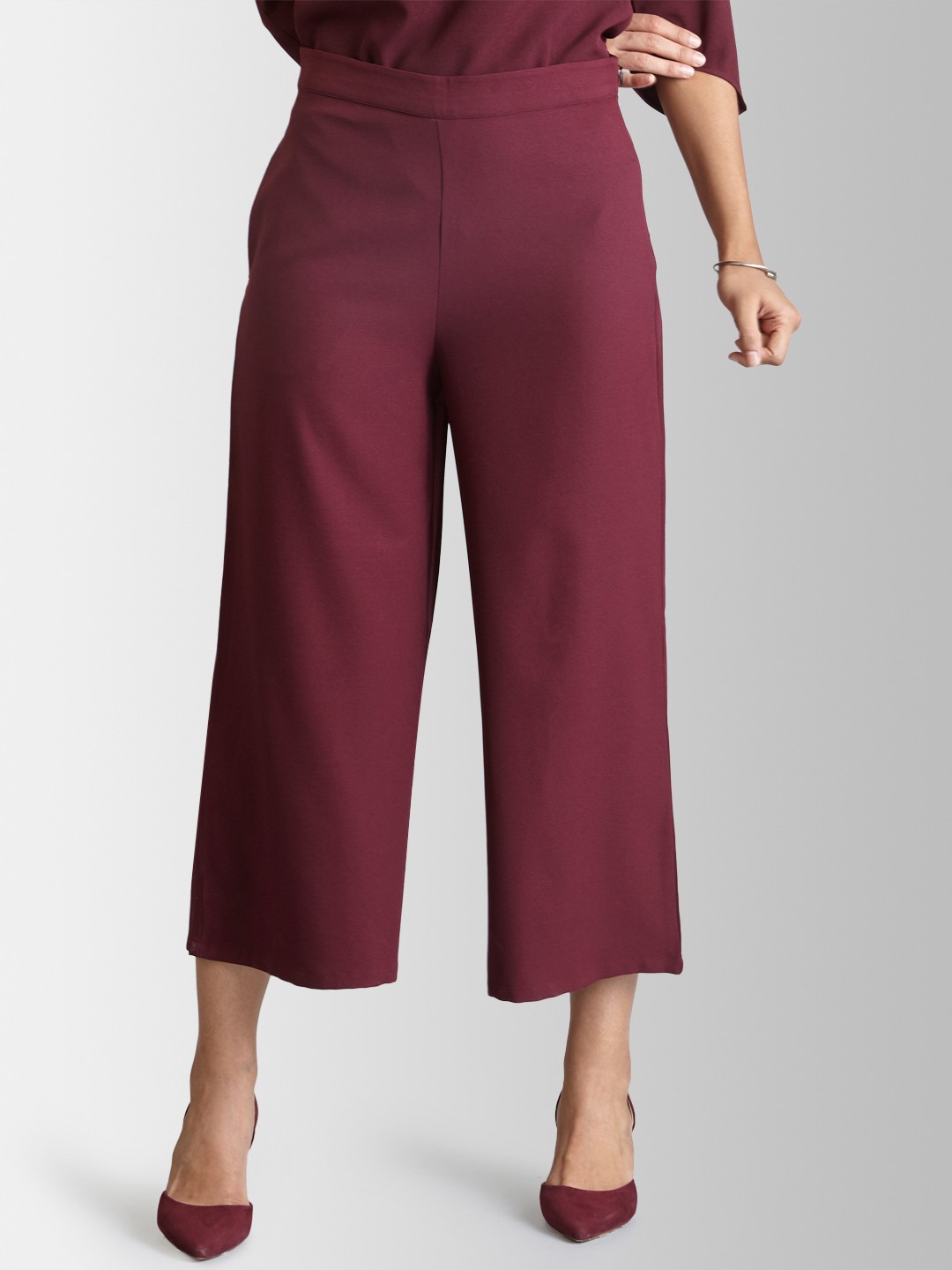 

FableStreet Women Maroon Flared Solid Parallel Trousers