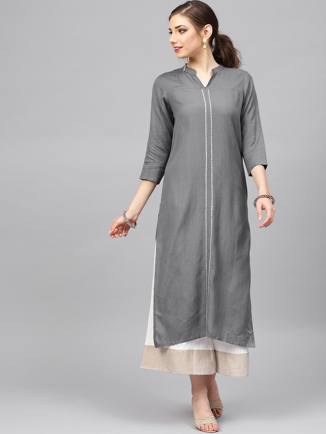 

Varanga Women Grey & White Solid Kurta with Palazzos
