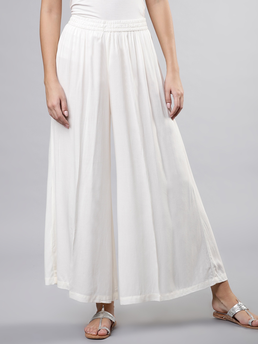 

Vishudh Women Off-White Solid Flared Palazzos