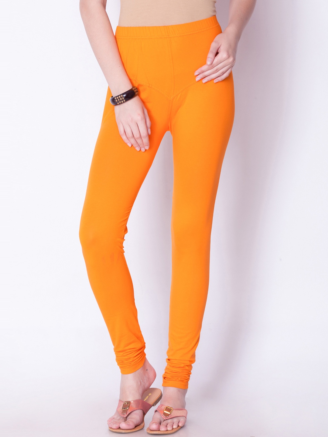 

Dollar Missy Women Mustard Orange Solid Churidar Length Leggings