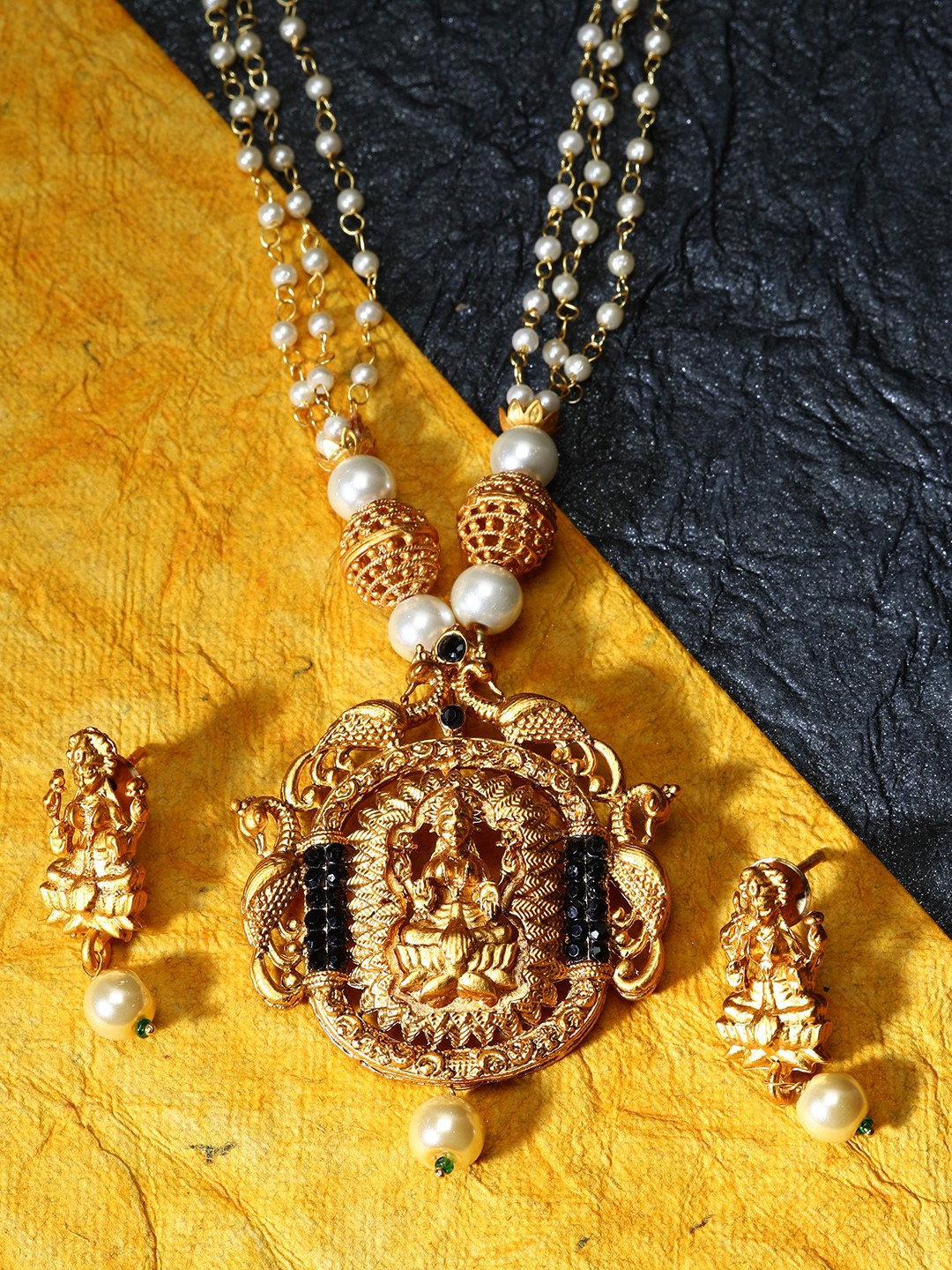 

ANIKAS CREATION Black & White Gold-Plated Artificial Stones & Faux Pearl Studded Maa Laxmi Temple Jewellery Set