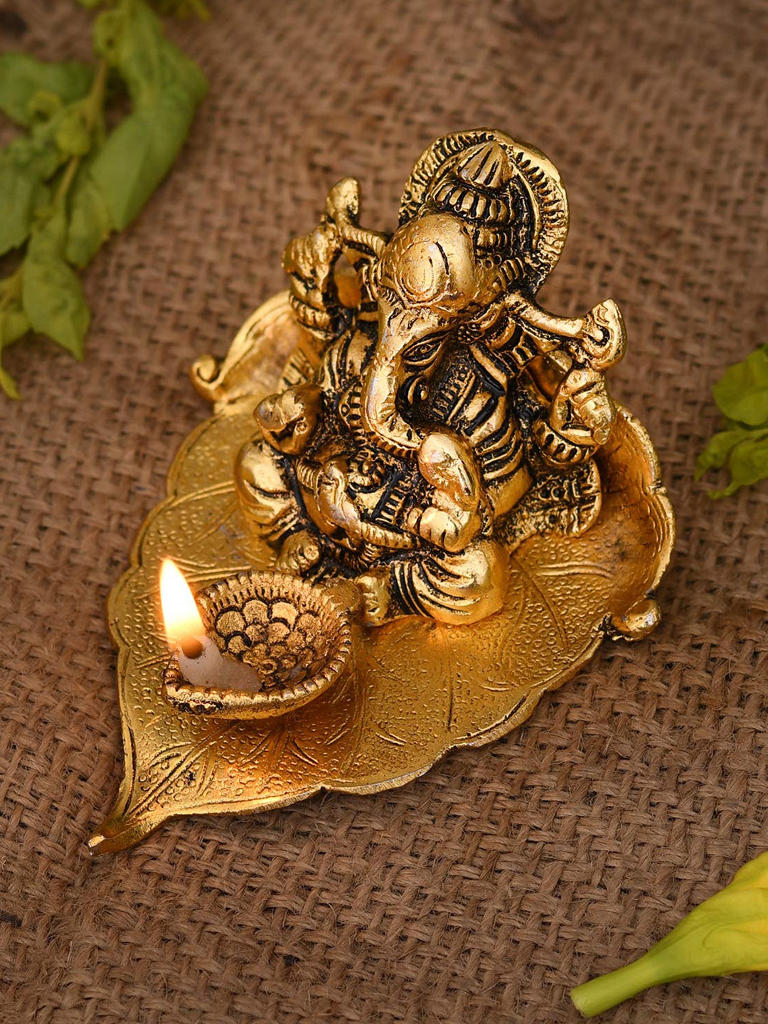 CraftVatika Gold-Toned & Black Ganesha On Leaf With Diya Showpiece