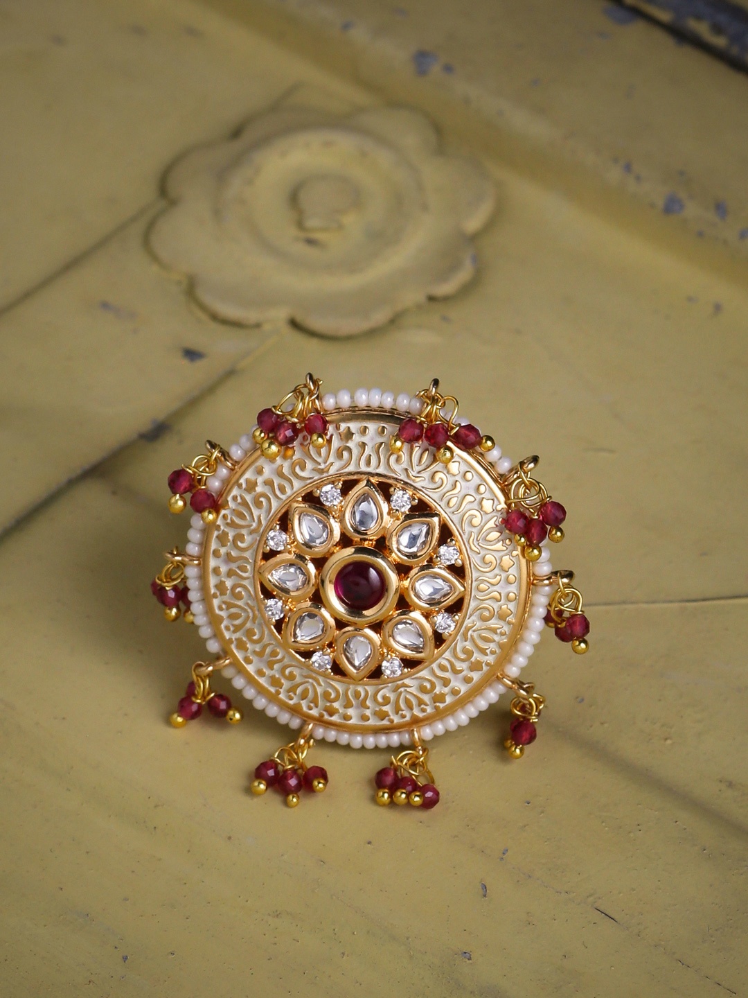 

Tistabene Gold-Plated Maroon & White Artificial Stone Embellished Enamelled Finger Ring