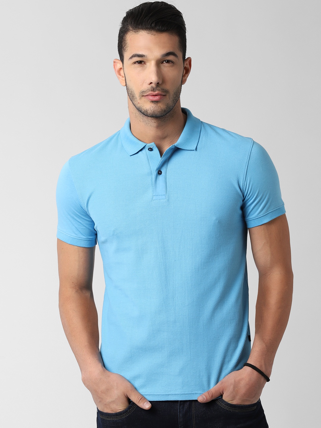 

Peter England Casuals Men Blue Solid Polo Collar T-shirt