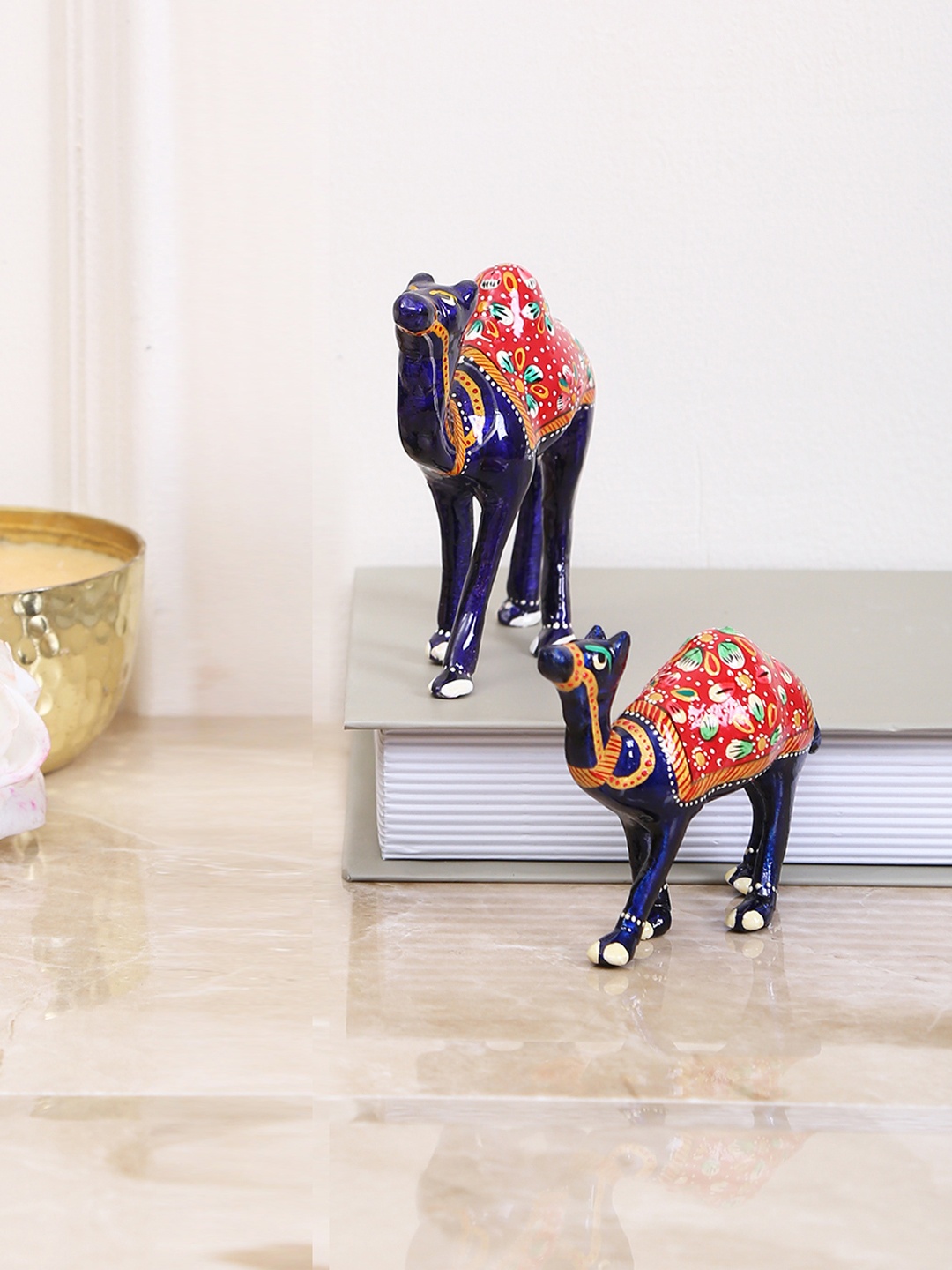 

Aapno Rajasthan Set of 2 Blue & Red Printed Camel Showpieces