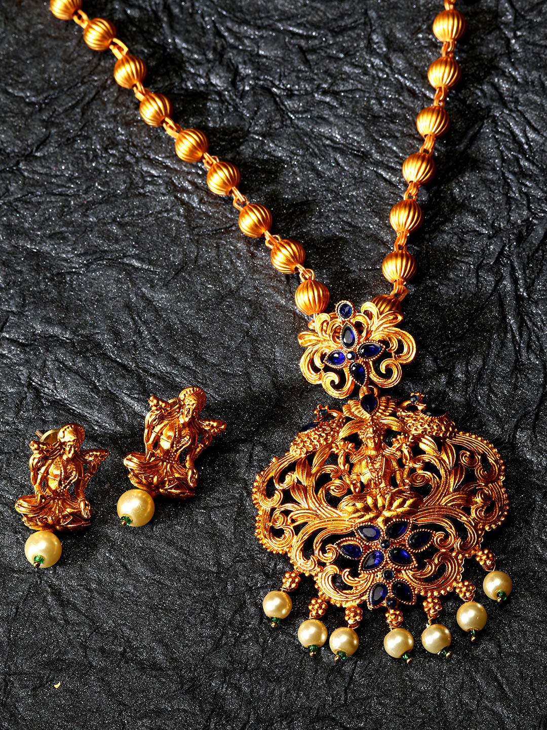 

ANIKAS CREATION Gold-Plated & Navy Blue Stone-Studded Beaded Maa Laxmi Temple Jewellery Set