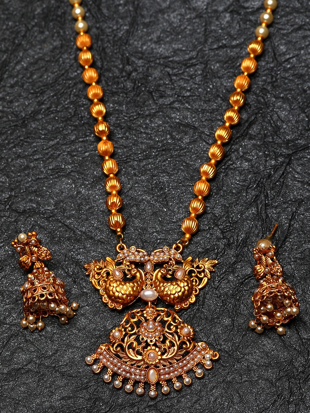 

ANIKAS CREATION Gold-Plated & White Pearl Beaded Peacock Shape Temple Jewellery Set