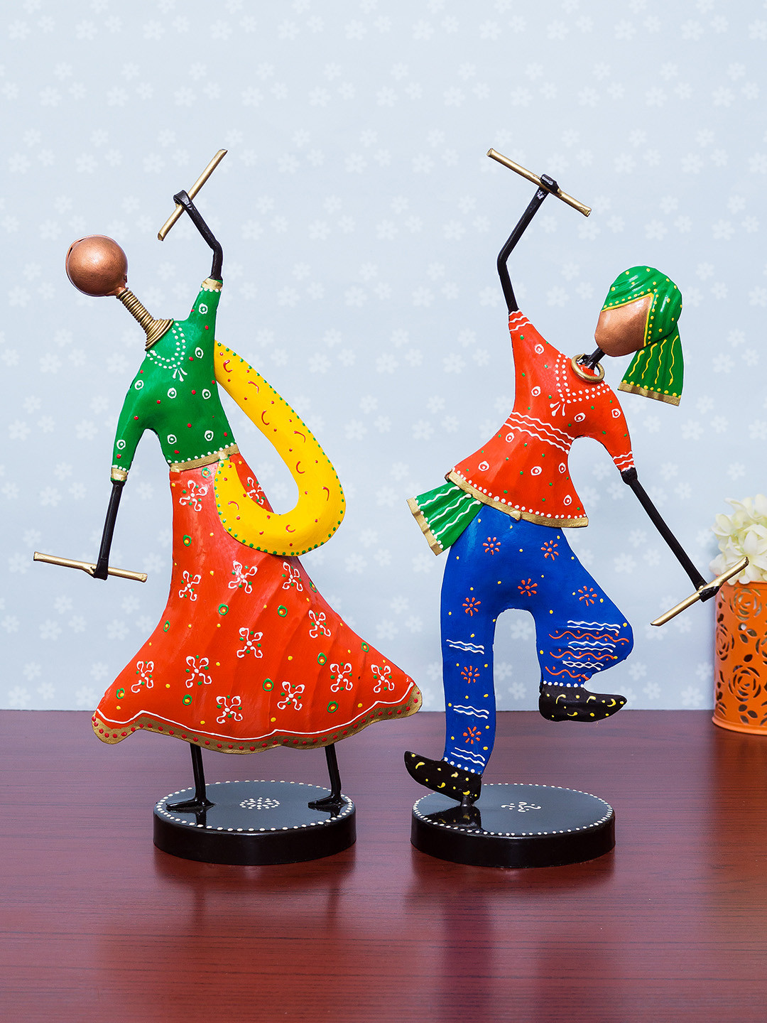 

Golden Peacock Set of 2 Orange & Green Handcrafted Metal Garba Playing Couple Showpiece