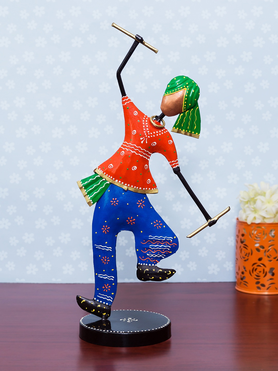 

Golden Peacock Orange & Green Handcrafted Metal Garba Playing Men Showpiece