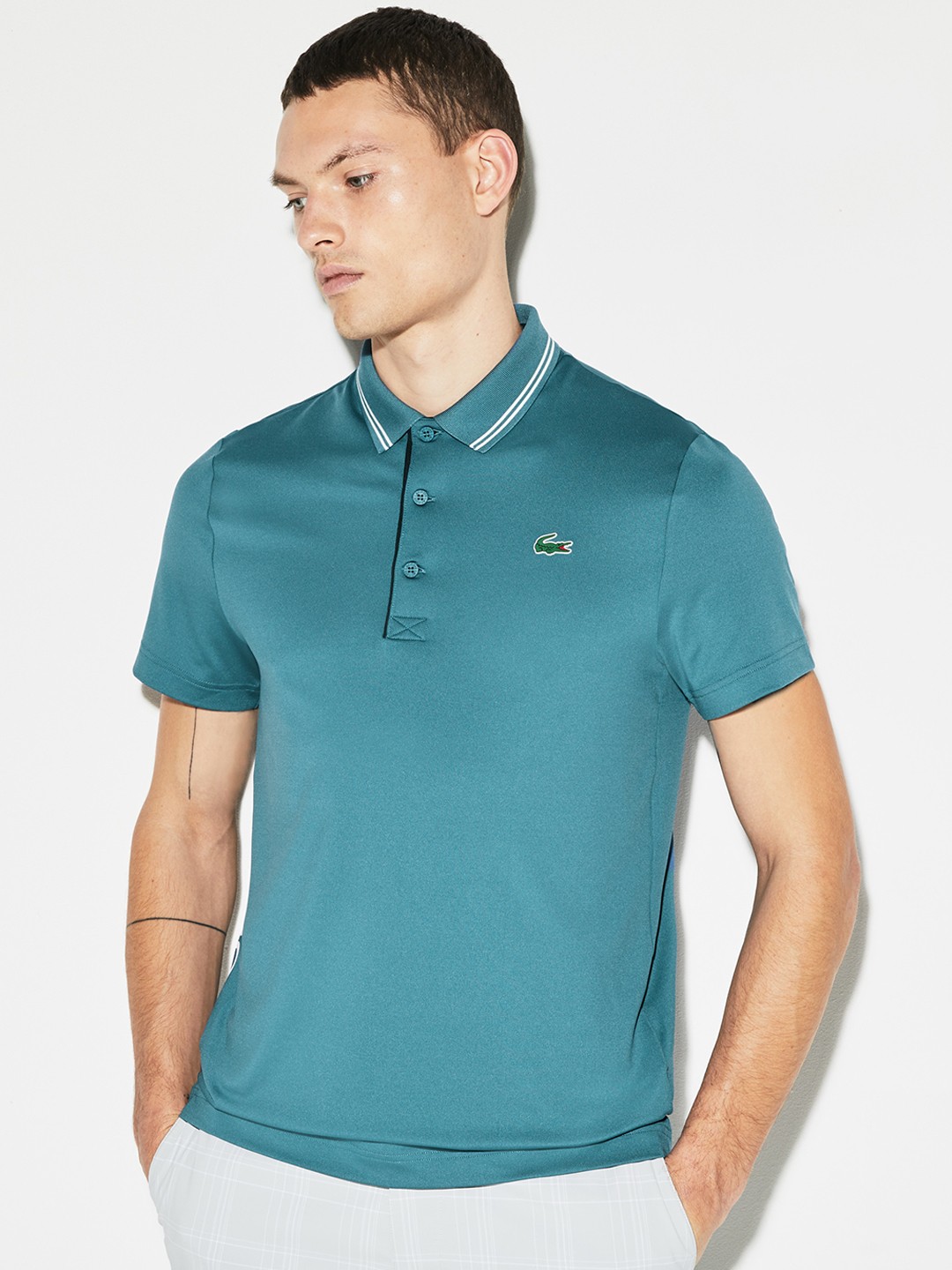 

Lacoste Men Blue Solid Polo Collar T-shirt