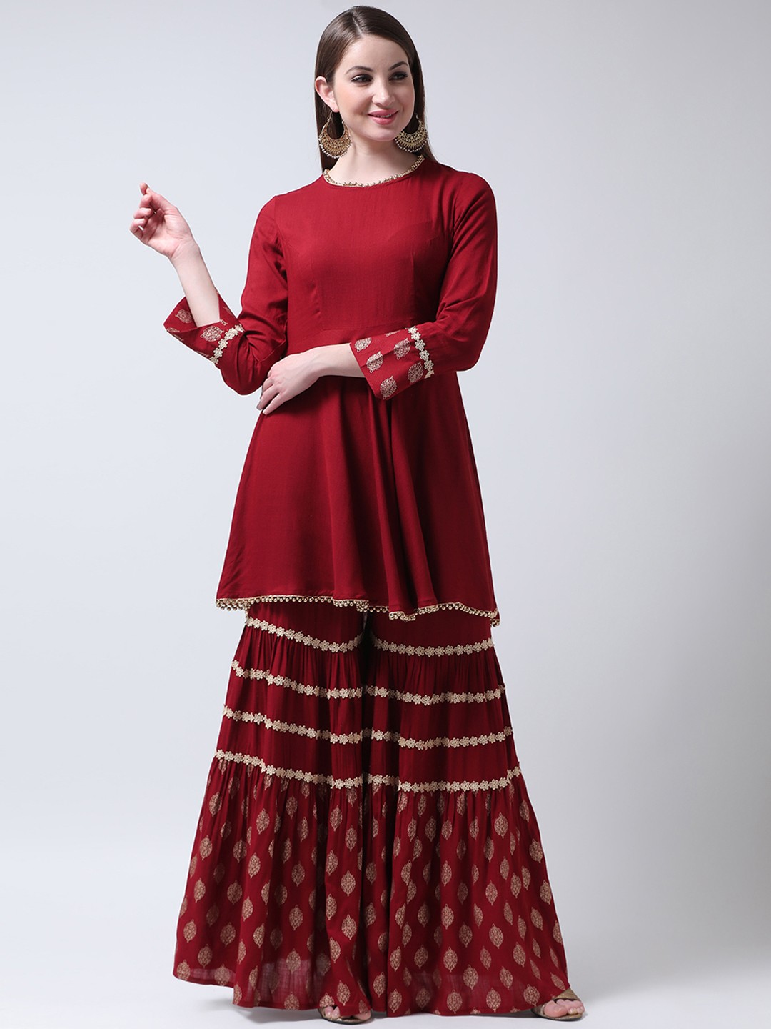 

Castle Women Maroon Solid Kurti with Sharara
