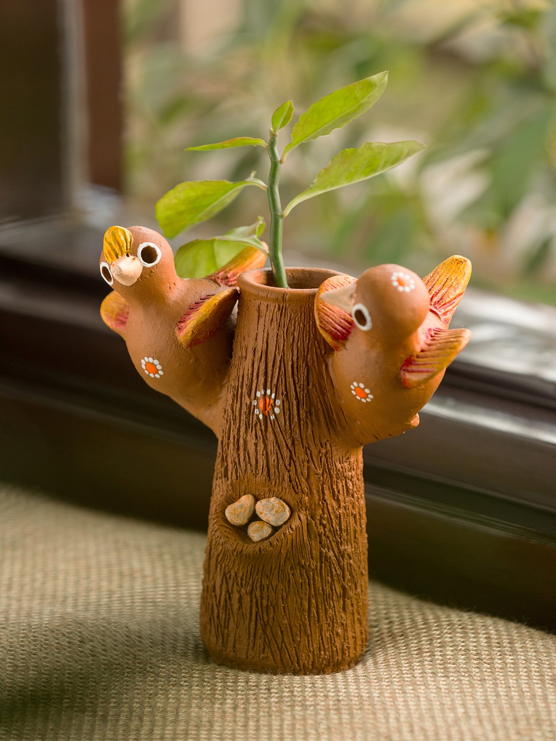 

ExclusiveLane Brown Hand-Painted Baby Cuckoos Terracotta Garden Showpiece