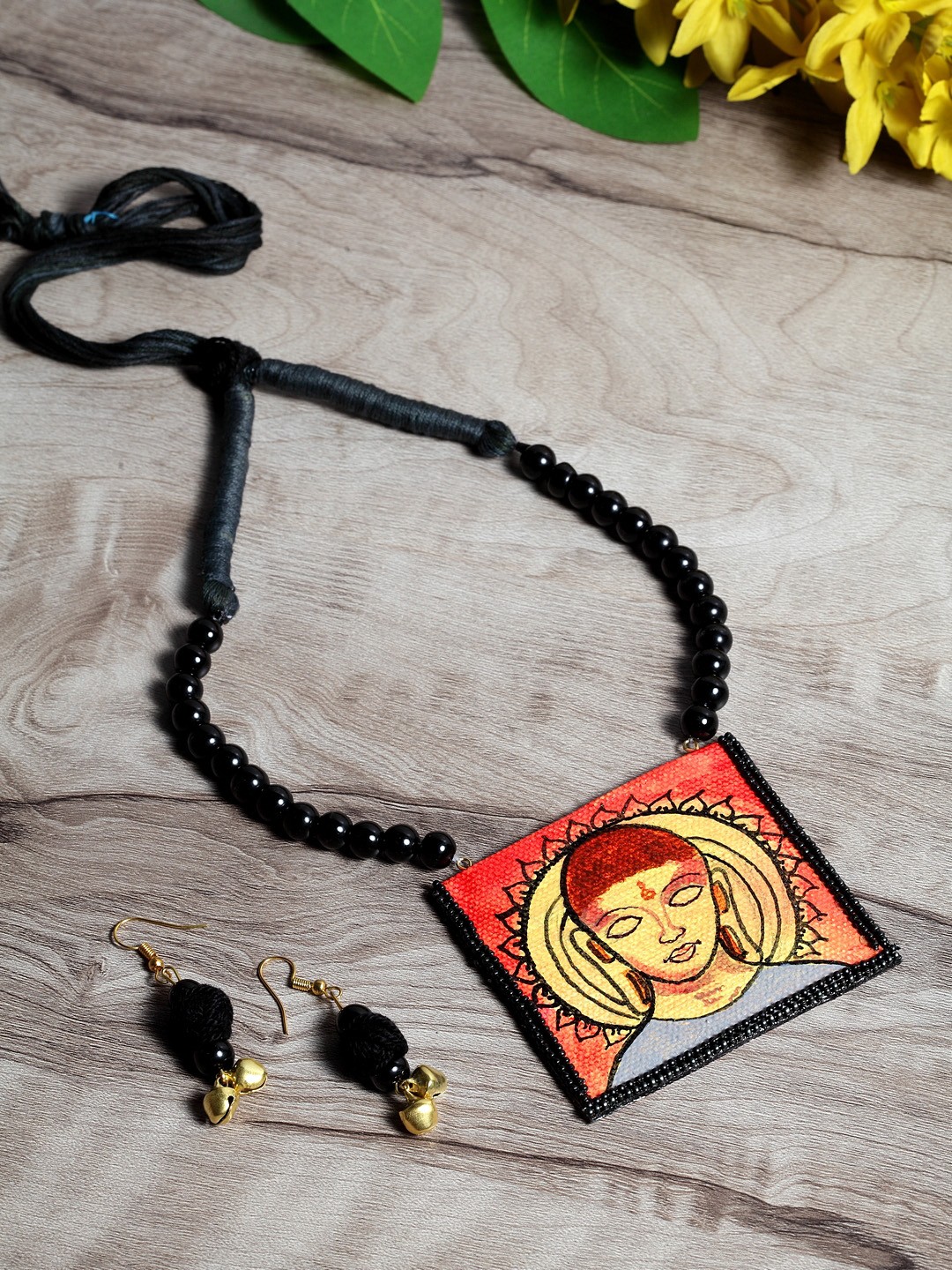 

Moedbuille Orange & Black Handcrafted Pearl Thread Buddha Jewelry Set
