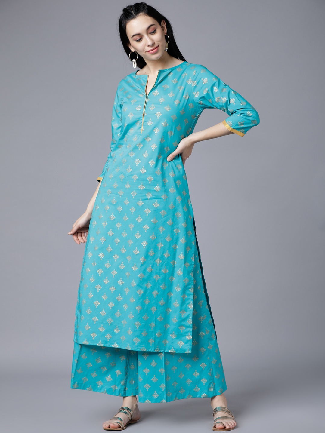 

Vishudh Women Turquoise Blue & Gold-Toned Printed Kurti with Palazzos