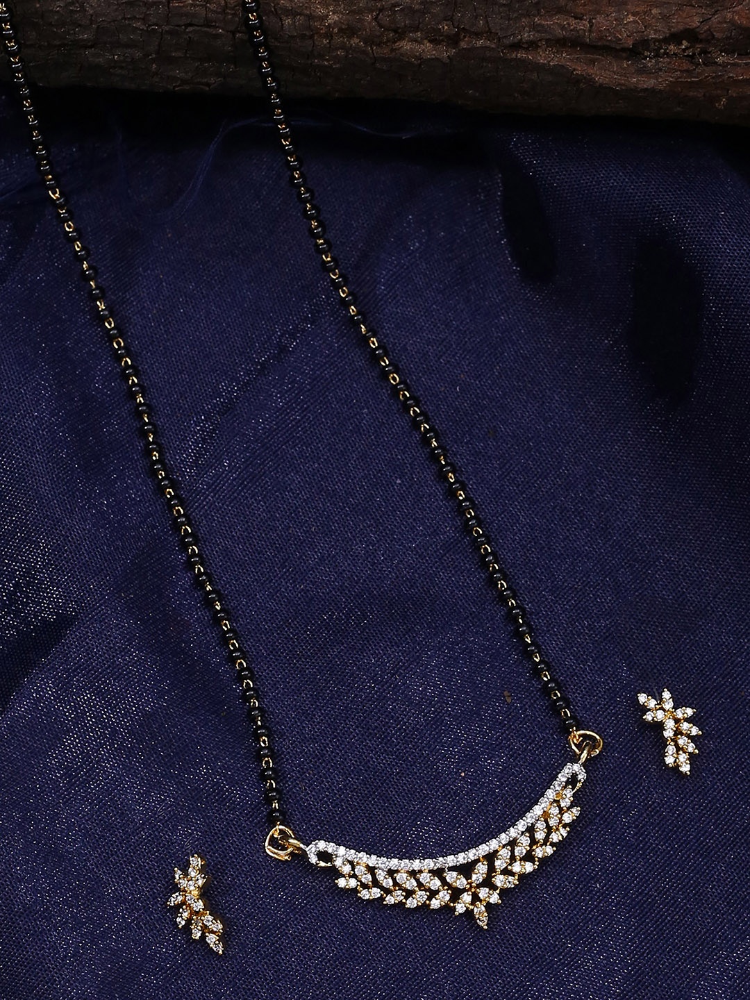 

Shoshaa Women Black Gold-Plated AD-Studded Mangalsutra with Earrings Set