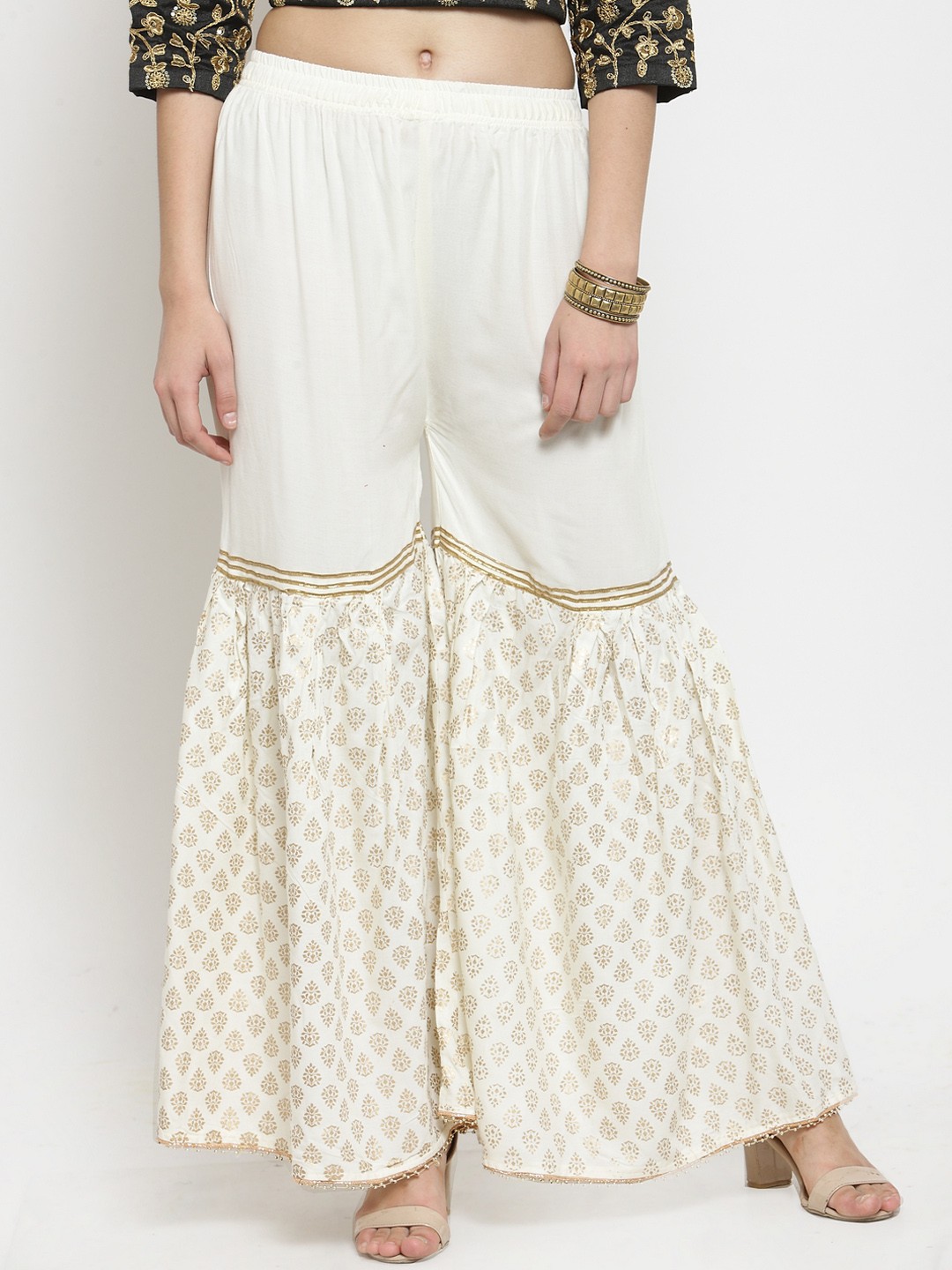 

Clora Creation Women Off-White Flared Printed Palazzos