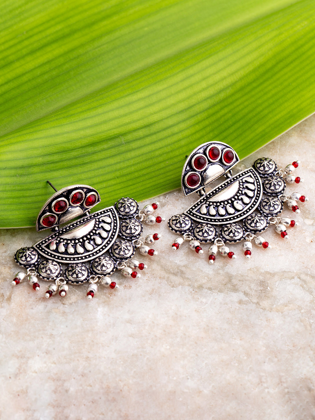 

Voylla Oxidised Silver-Plated & Maroon Handcrafted Stone-Studded Crescent Shaped Earrings
