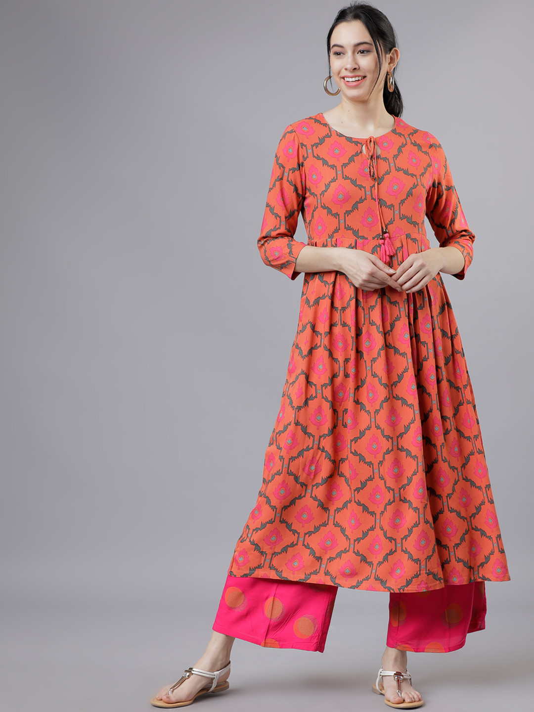

Vishudh Women Coral Orange & Pink Printed Kurta with Palazzos