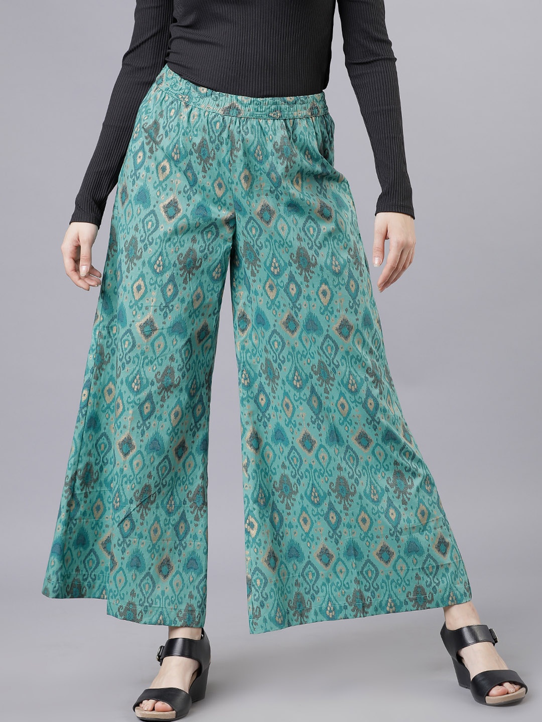 

Vishudh Women Green Printed Flared Palazzos