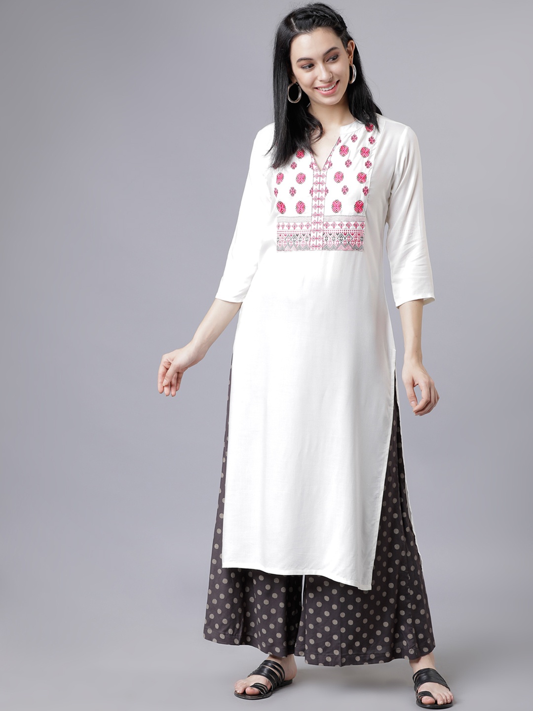 

Vishudh Women White Embroidered Regular Kurta with Palazzos