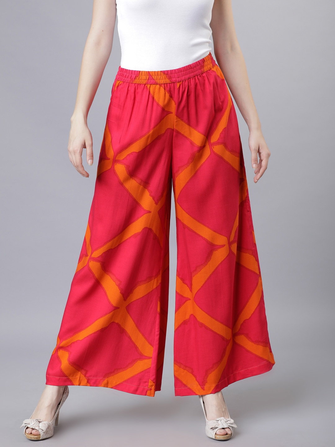 

Vishudh Women Coral & Orange Printed Flared Palazzos
