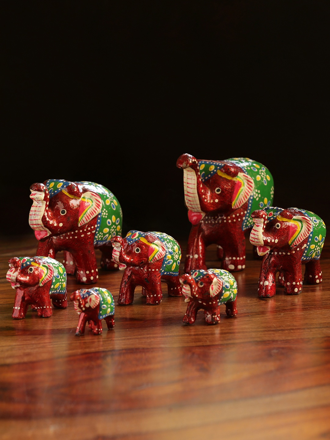 

ExclusiveLane Set Of 7 Maroon & Green Handcarved Elephants Showpieces