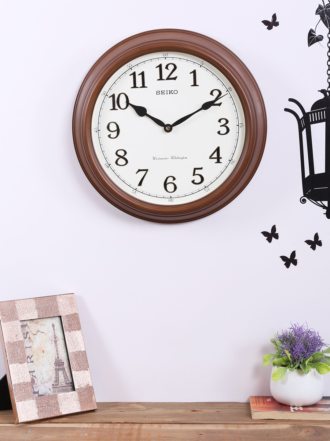 

SEIKO Unisex White & Brown Round Solid Analogue Wall Clock QXD214B