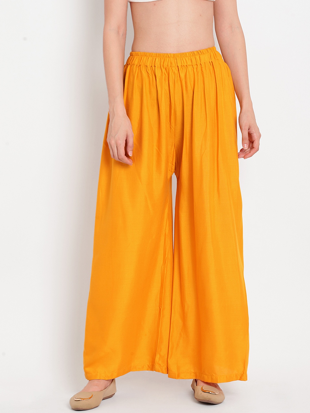 

TAG 7 Women Yellow Solid Flared Palazzos