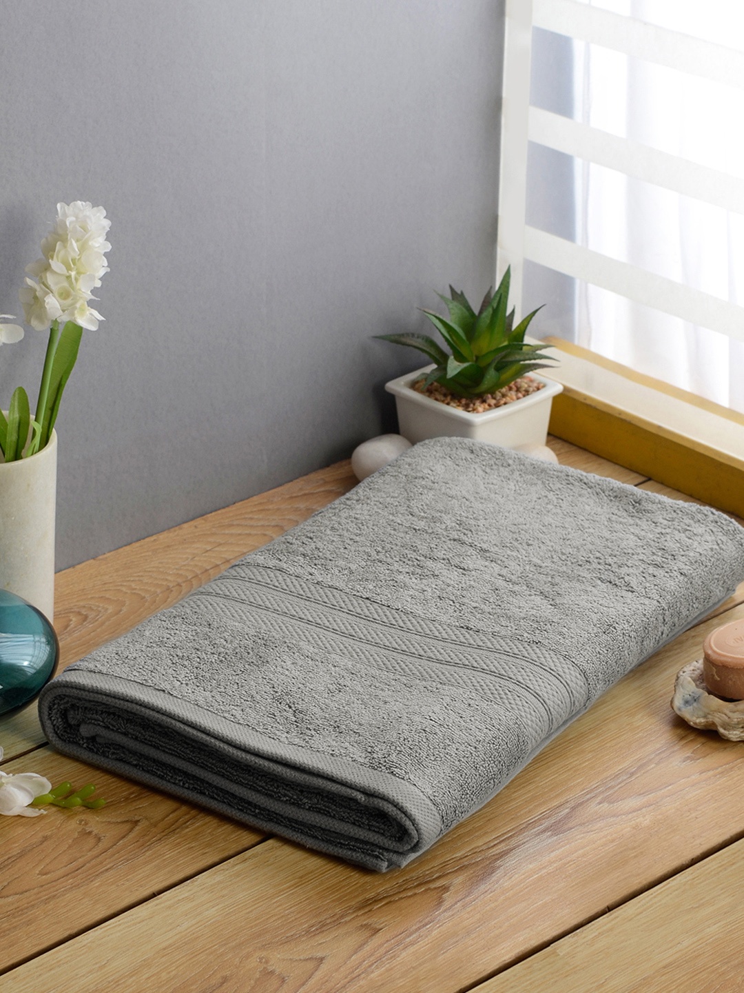 

Softweave Men Grey Self Design 525 GSM Bath Towel