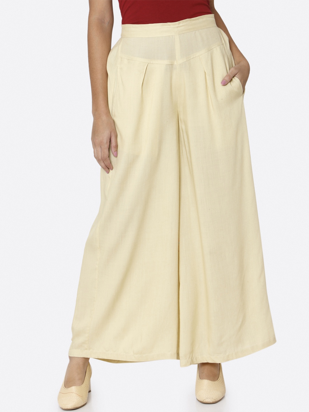 

RAISIN Women Cream-Coloured Solid Flared Palazzos