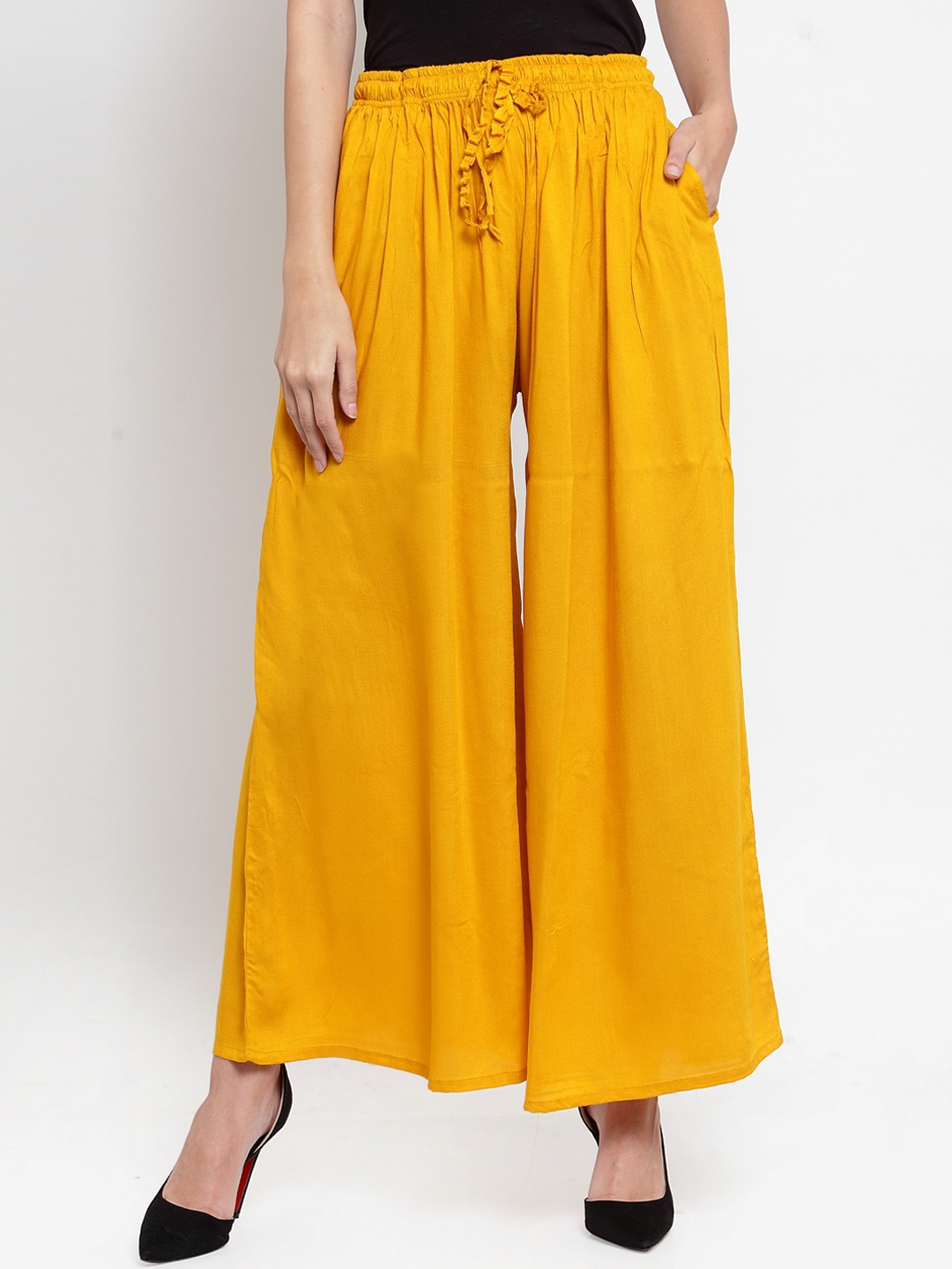

Clora Creation Women Mustard Solid Flared Palazzos