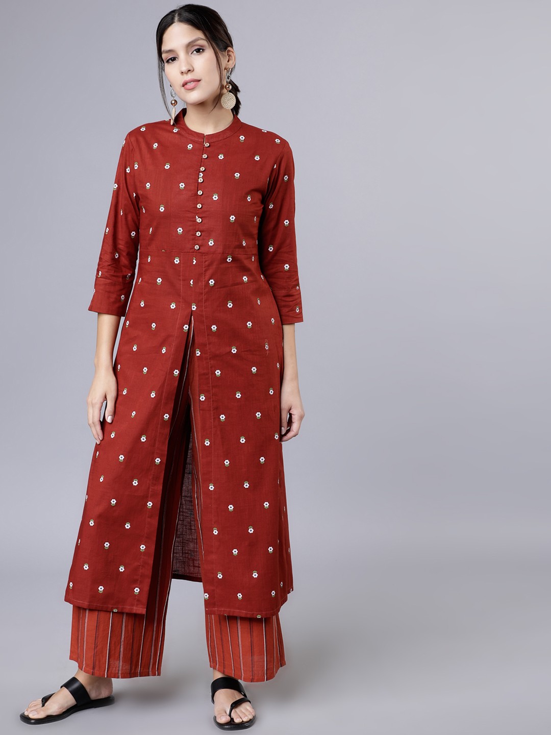 

Vishudh Women Rust Printed Kurti with Palazzos