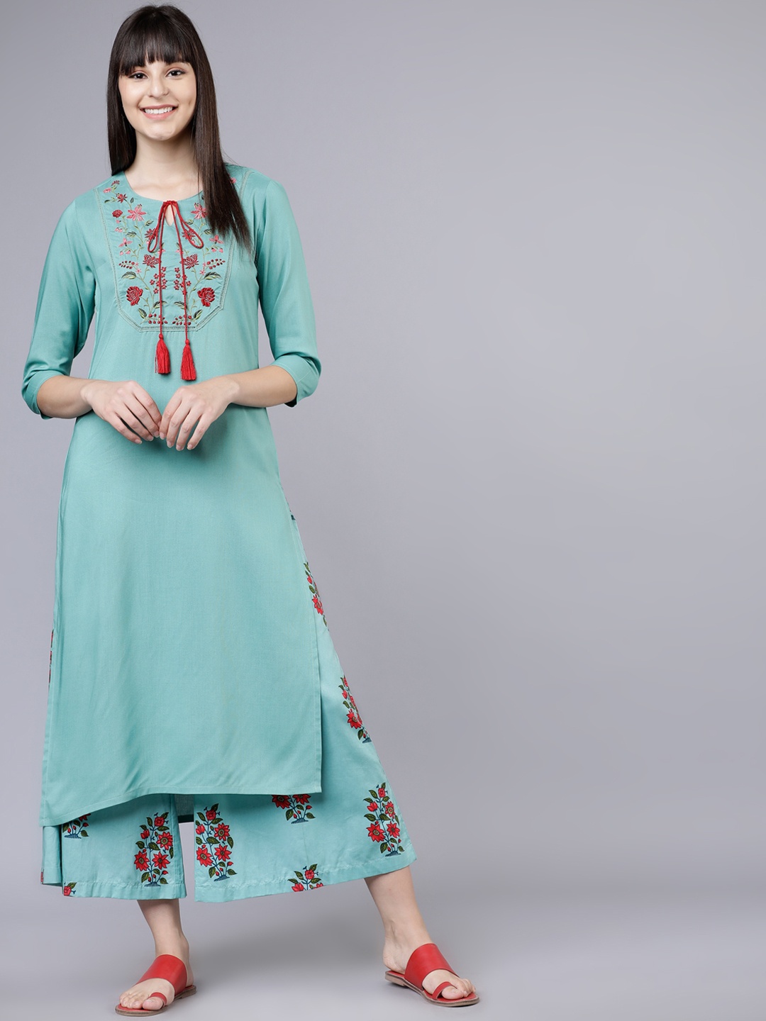 

Vishudh Women Turquoise Blue Floral Embroidered Regular Thread Work Kurta with Palazzos