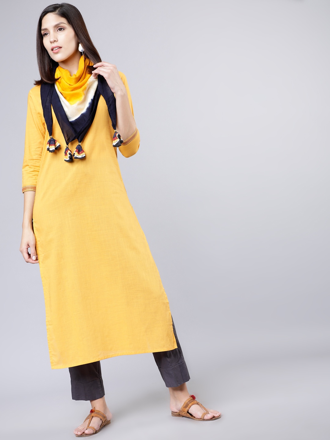 

Vishudh Women Mustard Yellow & Grey Solid Kurta with Palazzos