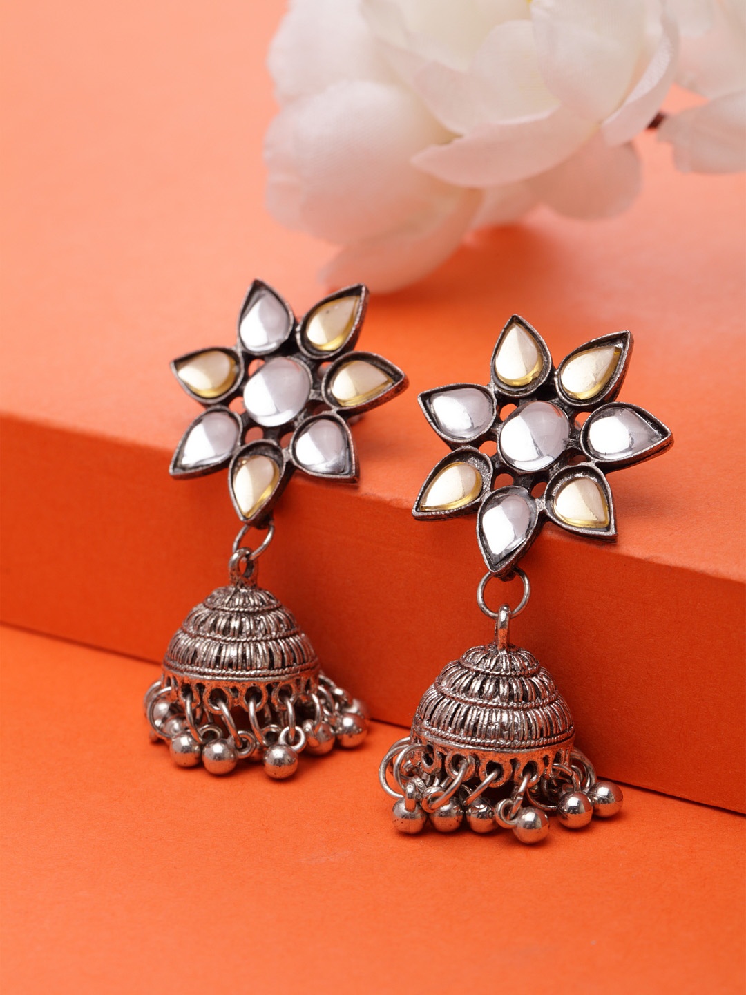 

Moedbuille Silver-Plated White Floral Oxidised Jhumkas
