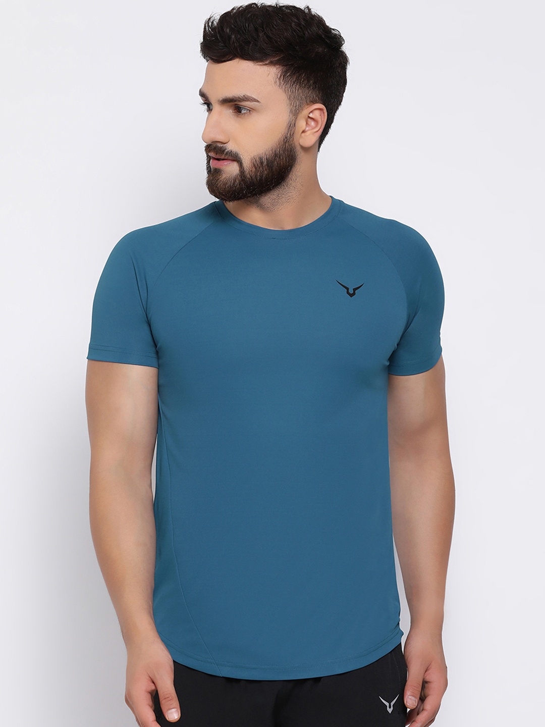 

Invincible Men Teal Solid Round Neck T-shirt