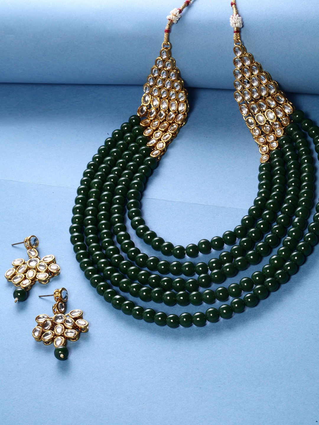 

Shining Diva Women Gold-Plated & Green Beaded Kundan Jewellery Set